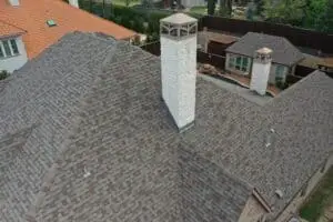 Final result of roof repair and chimney stone veneers