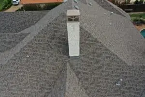 Final result of roof repair and chimney stone veneers