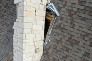 before photo of rebuilding a chimney and showing exposed roof