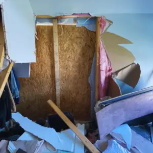the before photo of a car crashing into home
