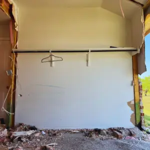 the During photo of a car crashing into home