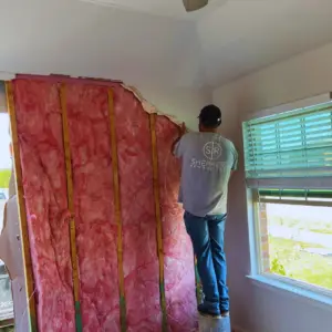 the During photo of a car crashing into home