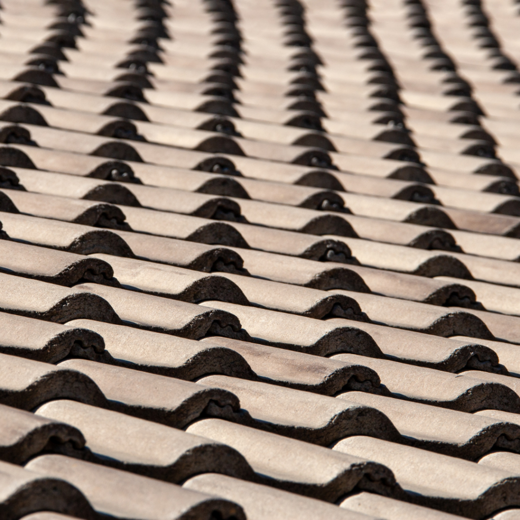photo of a concrete tile roof and how we can help repair or replace.