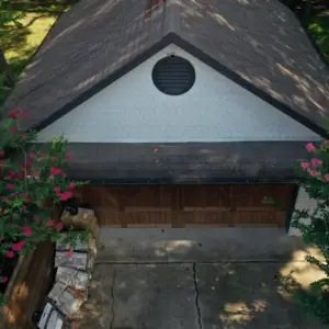 Old roof damage from hail storm in detached garage