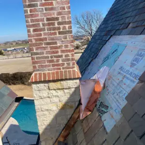 Replacing slate roof tiles by the chimney