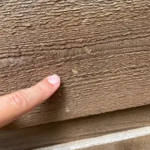 Hail damage on fence