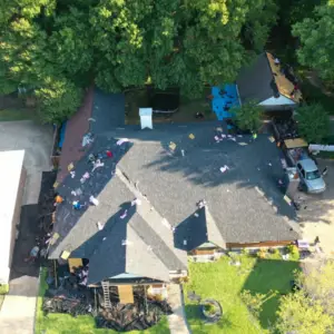 removing shingles from total roof replacement