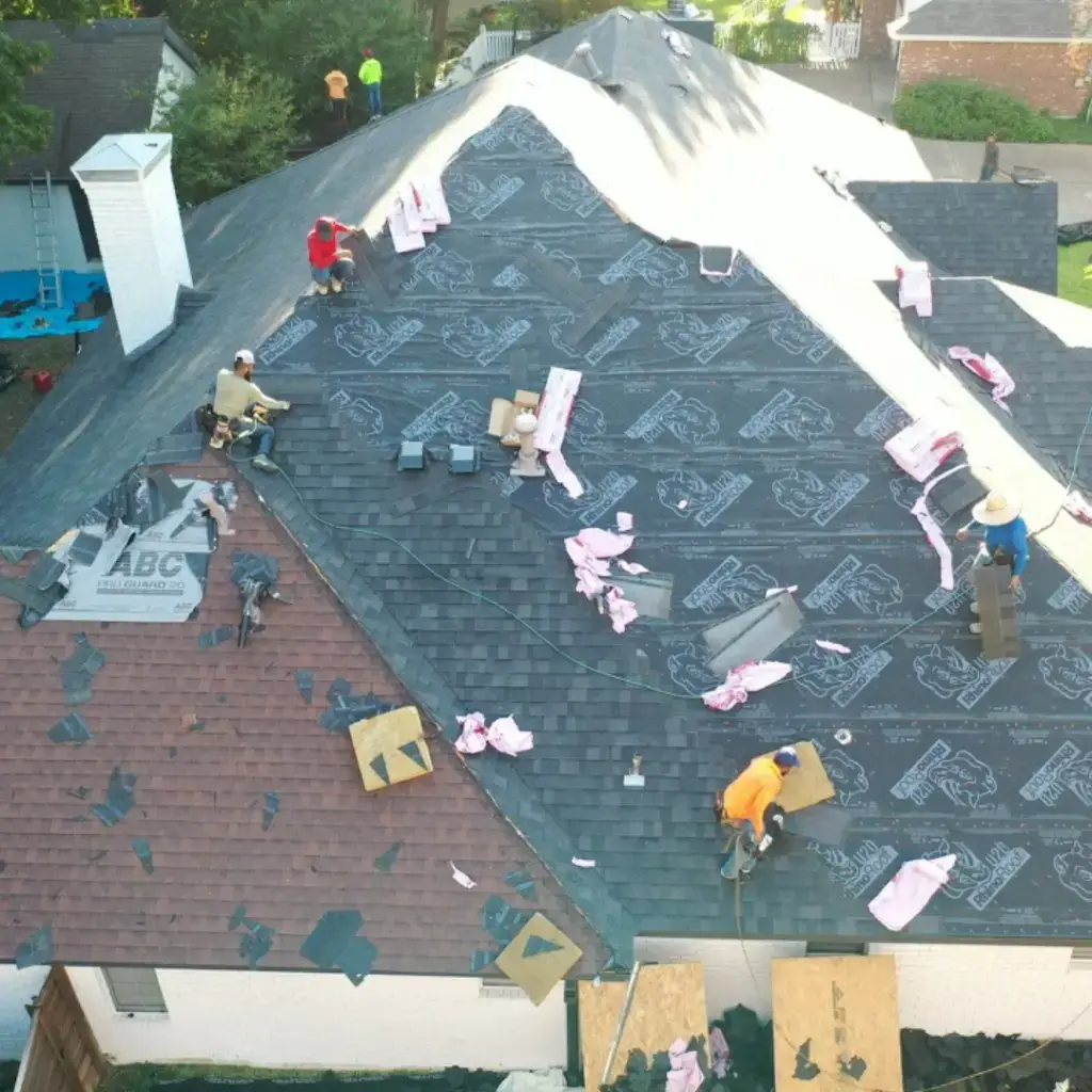 removing shingles from total roof replacement