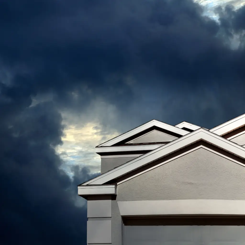 Home with storm coming in the background preparing your roof