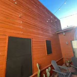 damaged siding on patio wall