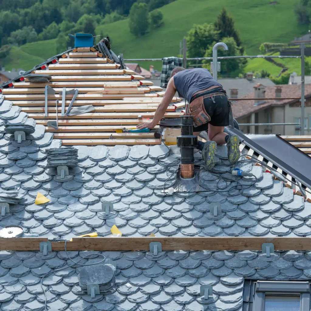 image of man roof installing slate roof