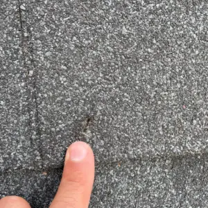 holes through shingles