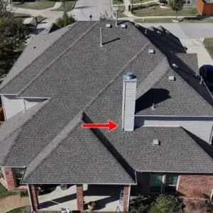 Drone view of roof replacement arrow showing the chimeny