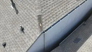 Cost Breakdown: Roof Repair vs Replacement – Roof Technician Repairing Shingles in Plano TX