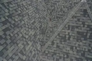 Improperly installed shingle valley on Frisco TX roof causing water intrusion