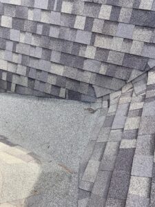 Roof valley close-up showing potential water entry point from low-slope shingle installation