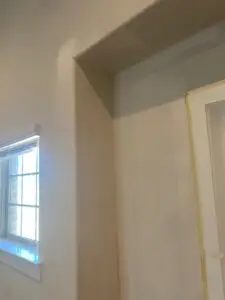 Repaired interior wall after roof leak restoration and drywall replacement in Frisco TX home